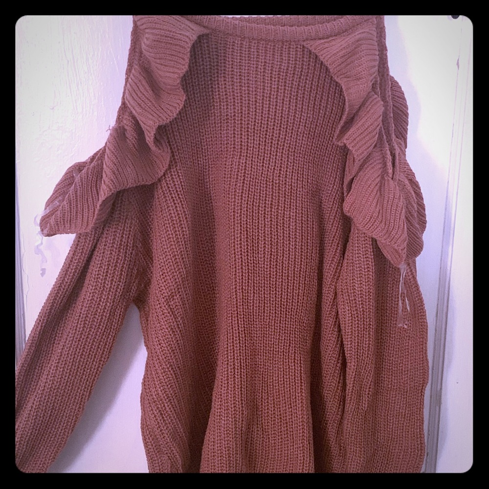 Ruffle sleeved sweater.